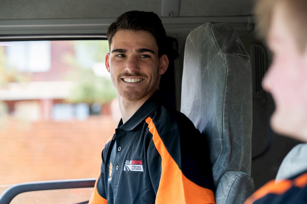 Removalist driver smiling in truck cab