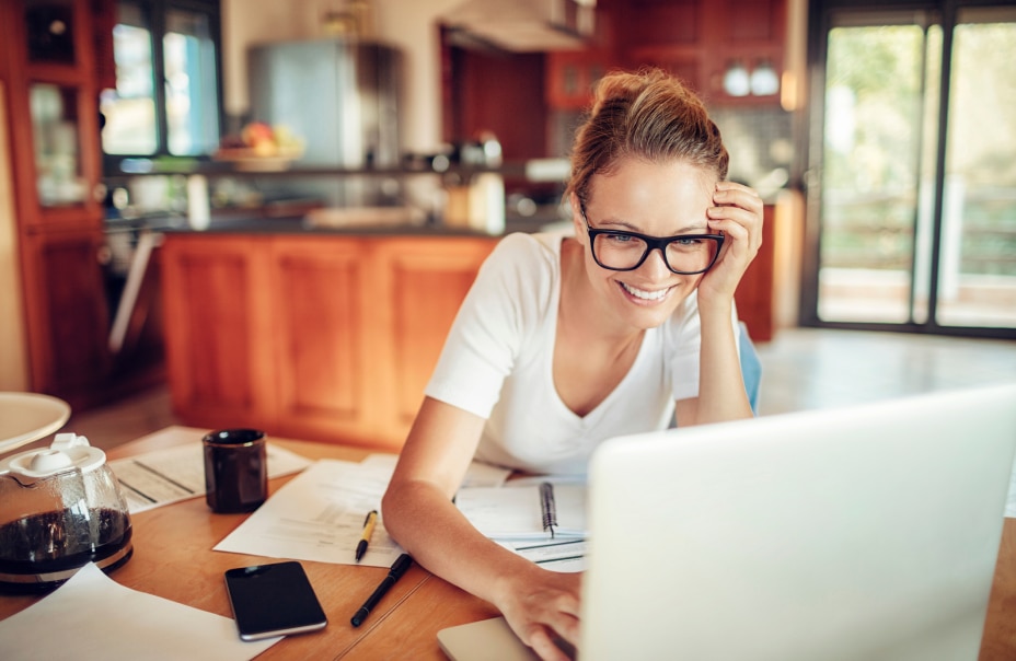 Woman wearing glasses in office smiling