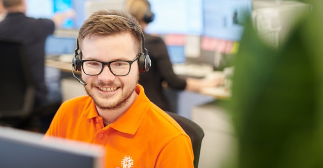 Smiling staff member with headset