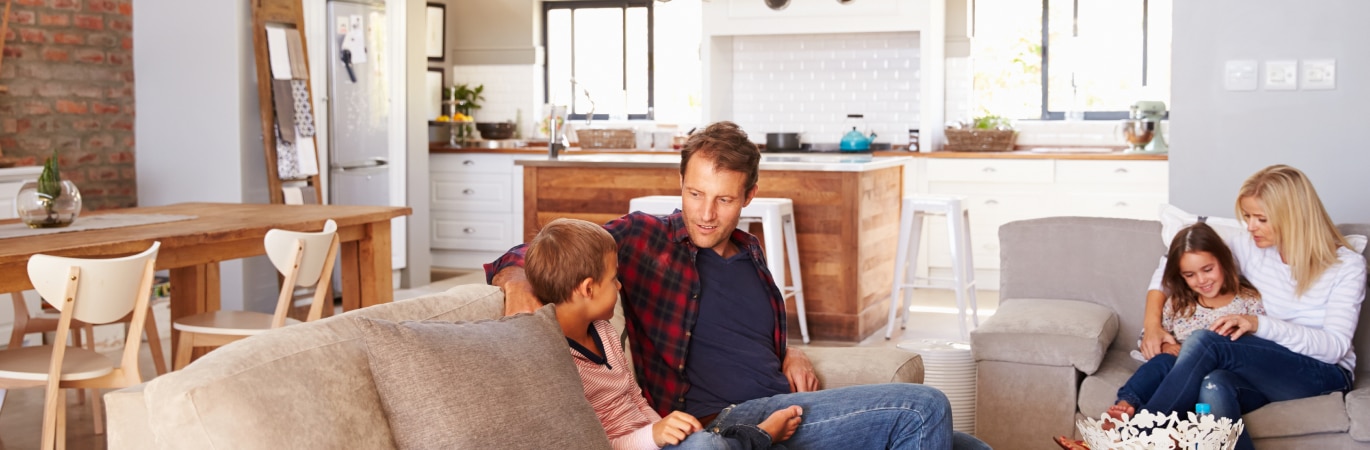 Father and son in living room