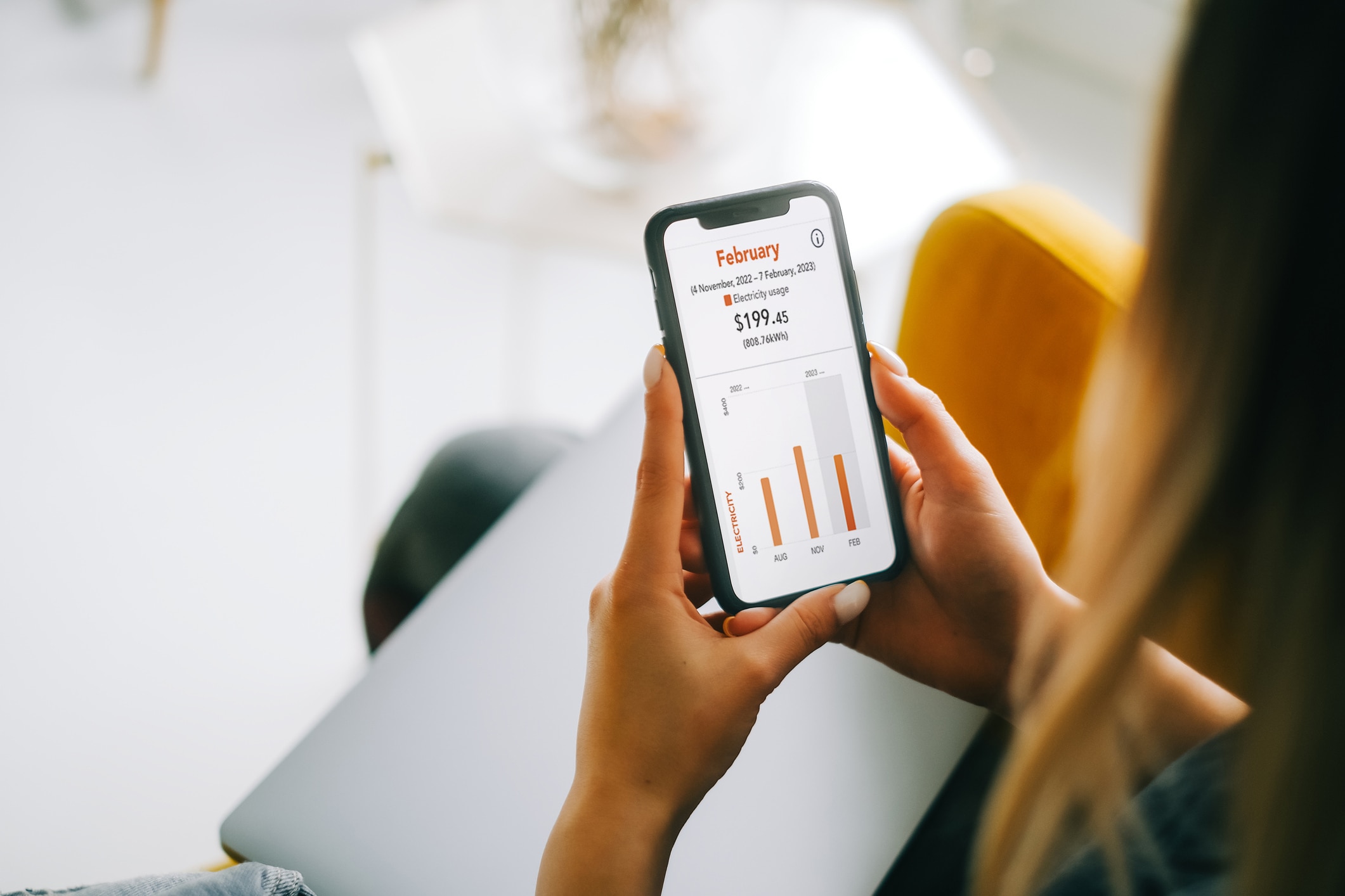 Woman looking at usage on mobile phone