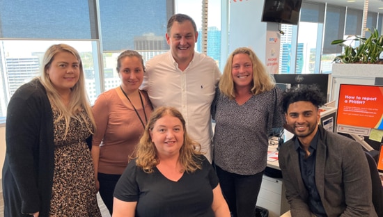 Alinta Energy CEO poses with staff from our Perth contact centre