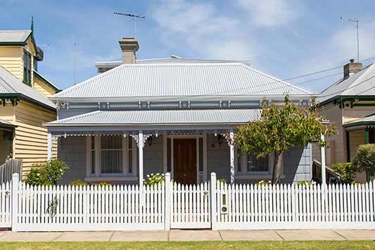 Federation style home with white picket fence