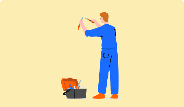 Graphic representation of a workman in overalls with a toolbox on the floor, working with some tools