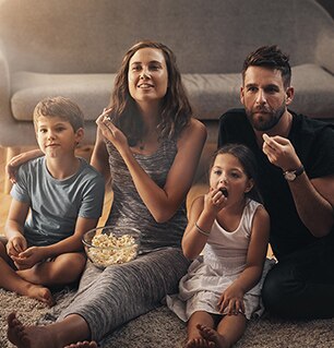 family watching movie in living room